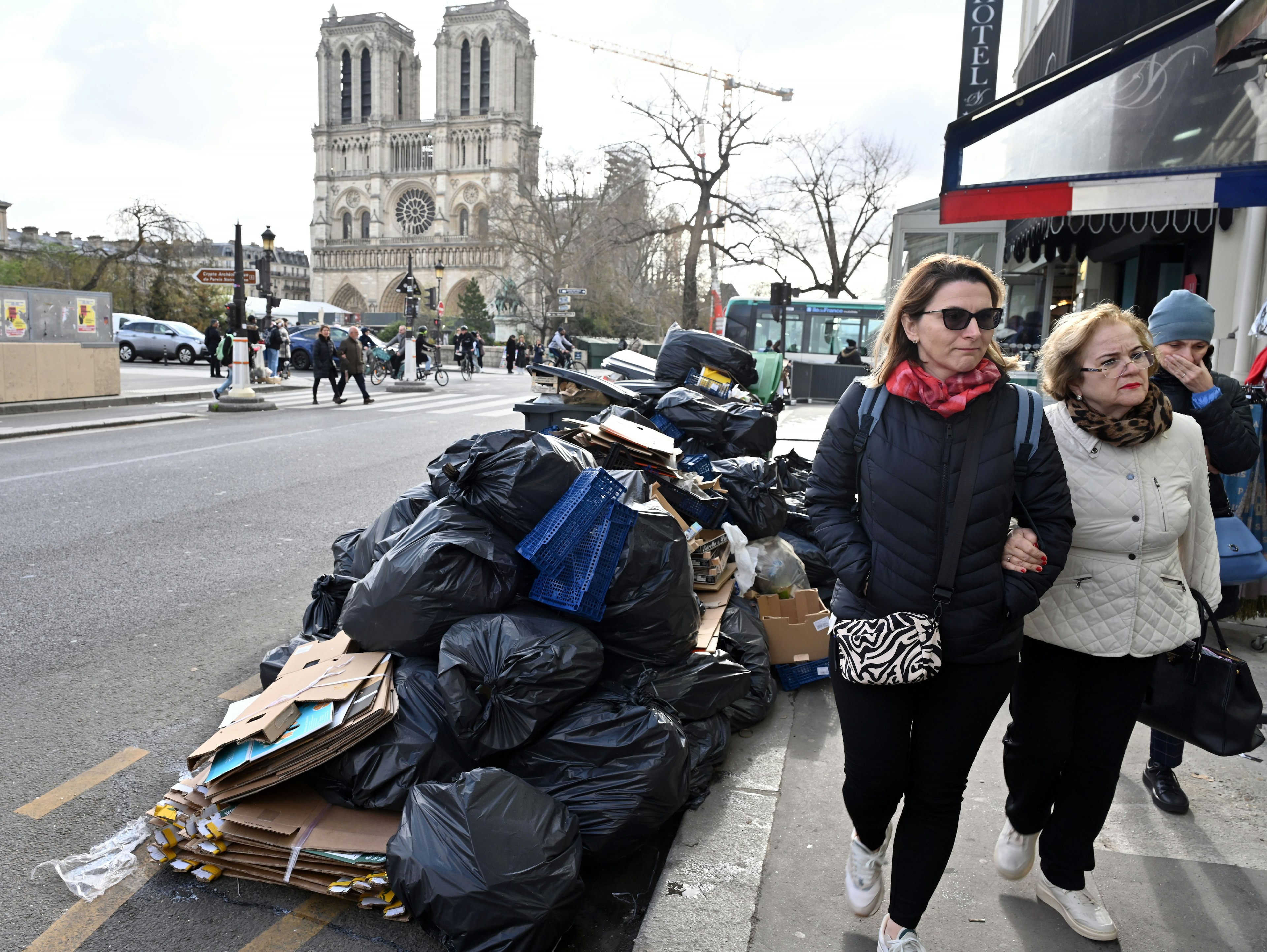 Garbage cans overflowing with trash on the streets of near Notre Dame, Paris, Île-de-France, France