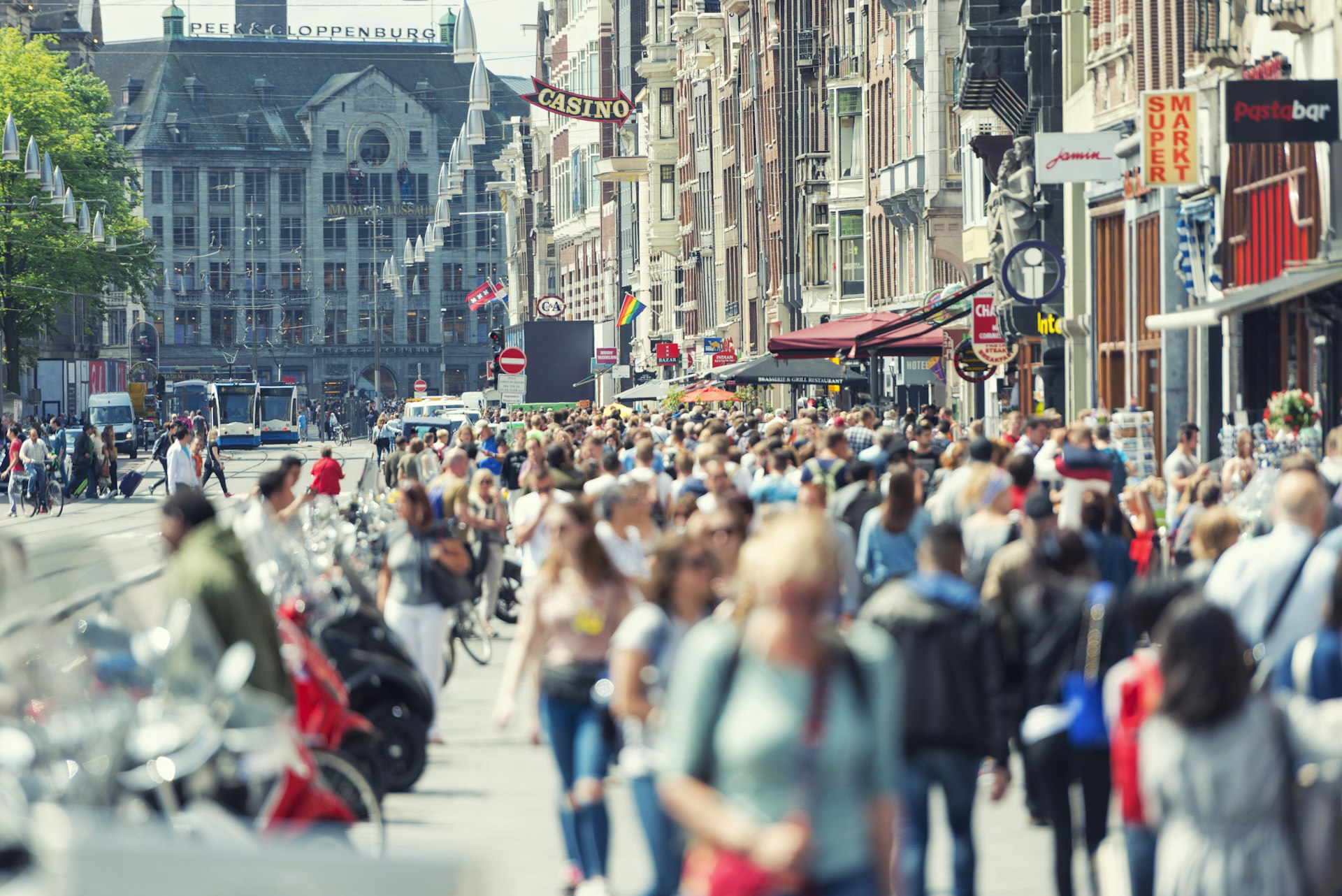 Crowds along Damrak in central Amsterdam, Netherlands