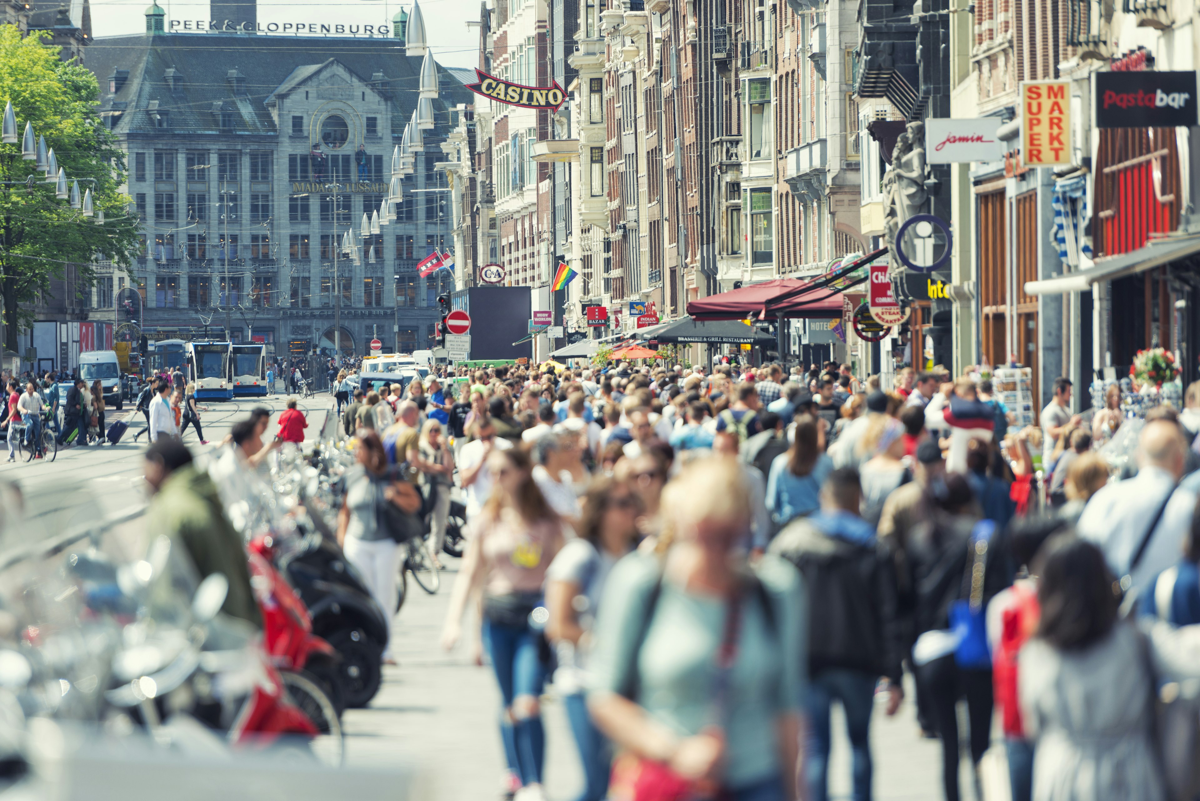 Crowds along Damrak in central Amsterdam, Netherlands