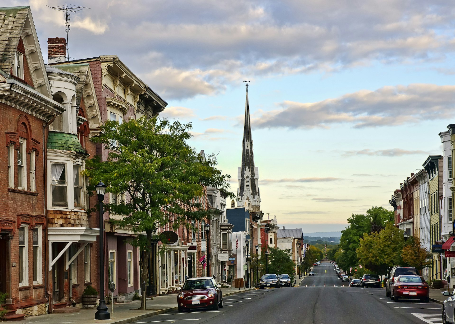 Buildings line a historic rural New York State street at dawn. 