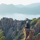 Le Calanques de Piana, Gulfe de Porto, Corsica, France, June 2004
200151543-001
freedom, escapism, contemplation
Man sitting on a rocky peak in Le Calanques de Piana, Gulfe de Porto, Corsica