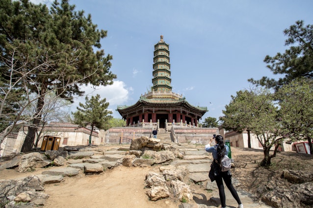 CHENGDE, HEBEI PROVINCE, CHINA - 2015/04/23: Seven-story octagonal Liuli-Wanshou pagoda (Glazed Tile Pagoda of Longevity).  The Xumi Fushou Temple (Temple of  Sumeru Happiness and Longevity) is one of the Eight Outer Temples in Chengde,  which are listed as the World cultural sites along with Chengde Mountain Resort.  The temple was first designed in 1780 to celebrate the 70th Birthday of Emperor Qianlong and built for Penchen Lama the VI. (Photo by Zhang Peng/LightRocket via Getty Images)
471431506
Xumi Fushou Temple, Temple of  Sumeru Happiness and Longevity, Eight Outer Temples, Chengde, World Heritage site, Mountain Resort, temple, Chinese, China, Tibetan, architecture, religion, belief, Buddhist, Buddhism, historic, imperial, relic, travel destination, tourist attraction, tourism, pagoda, glazed