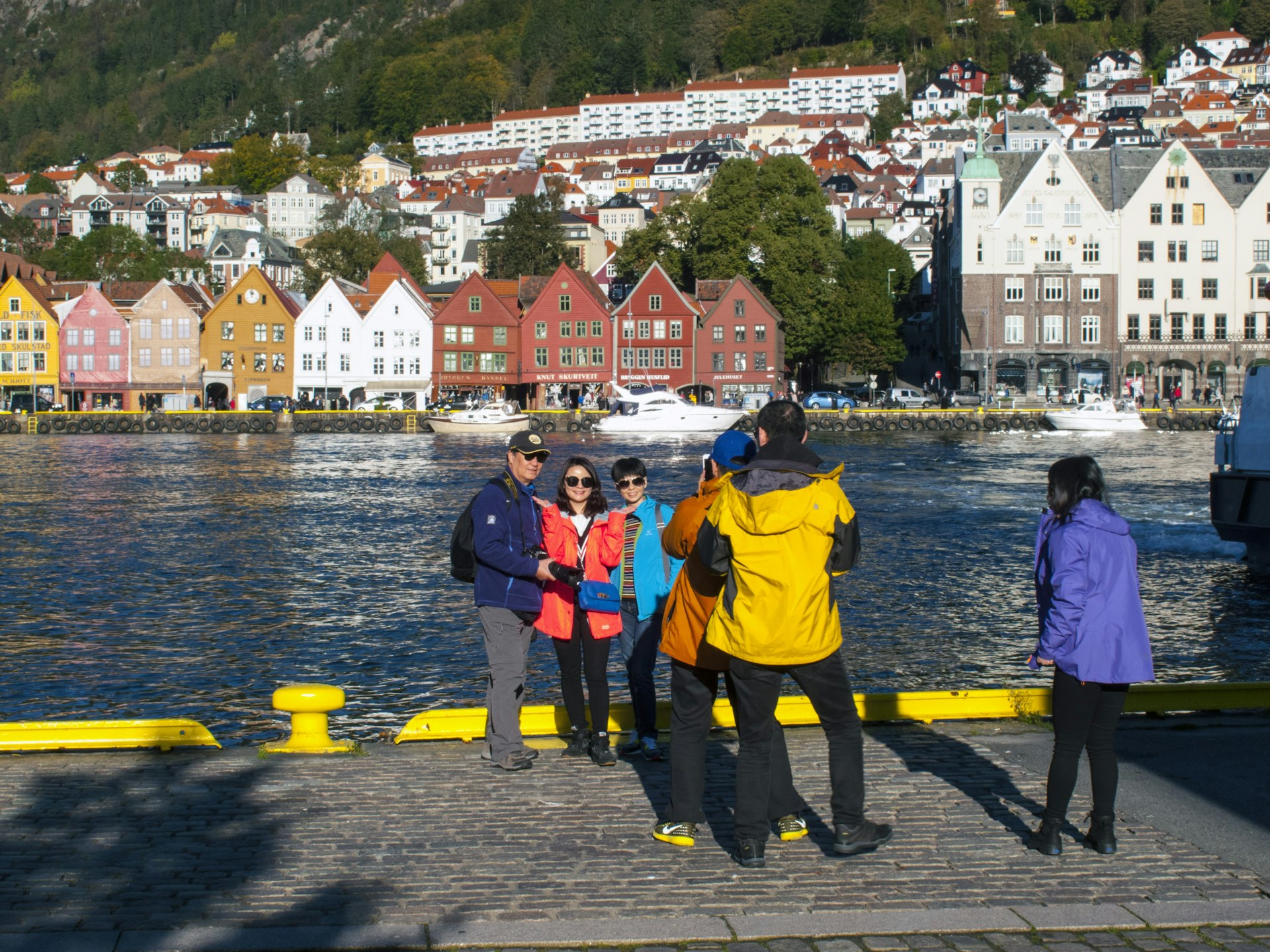 Tourists on the water by Bryggen, Bergen, Norway
