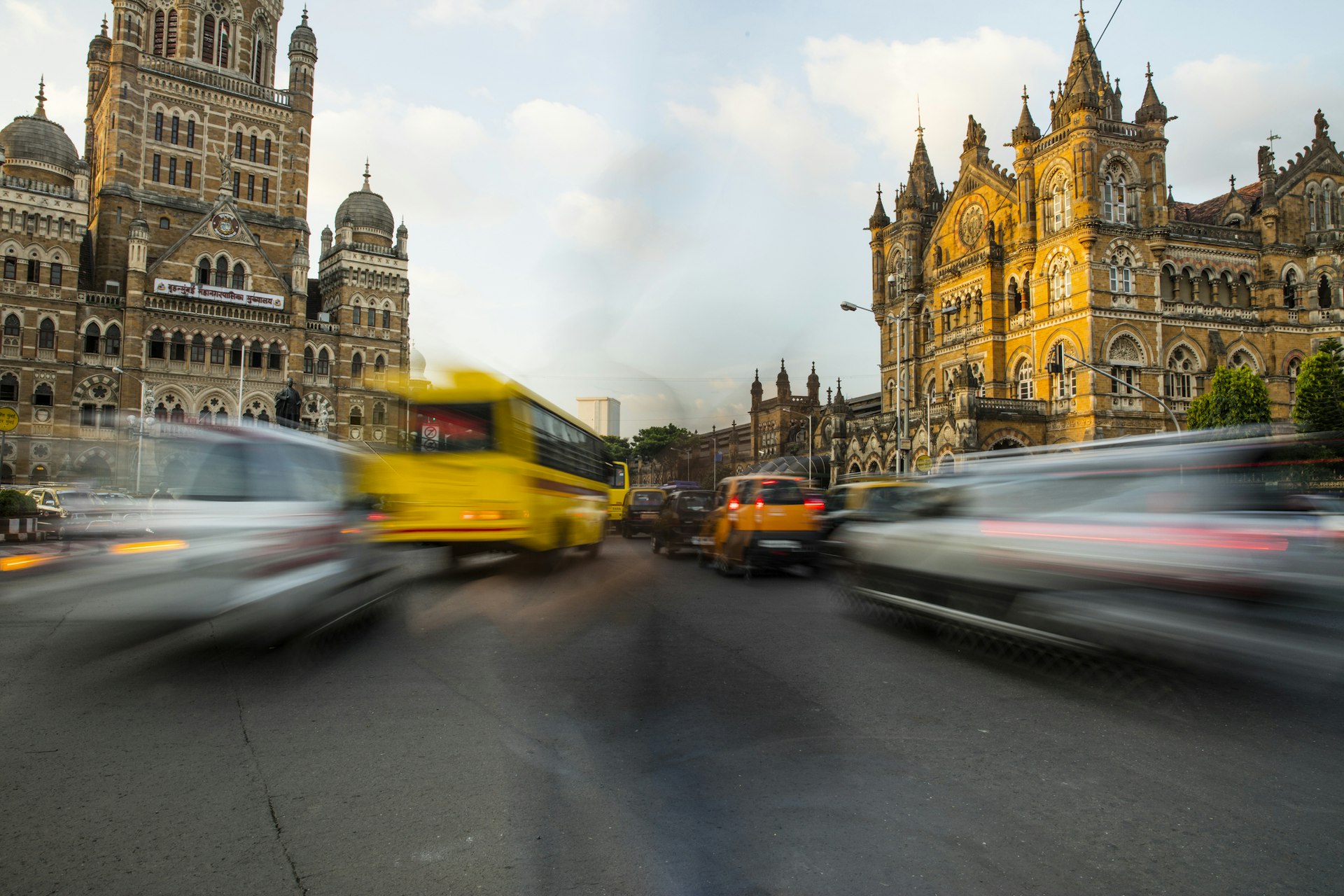 Cars and other vehicles are a blur on the streets of Mumbai