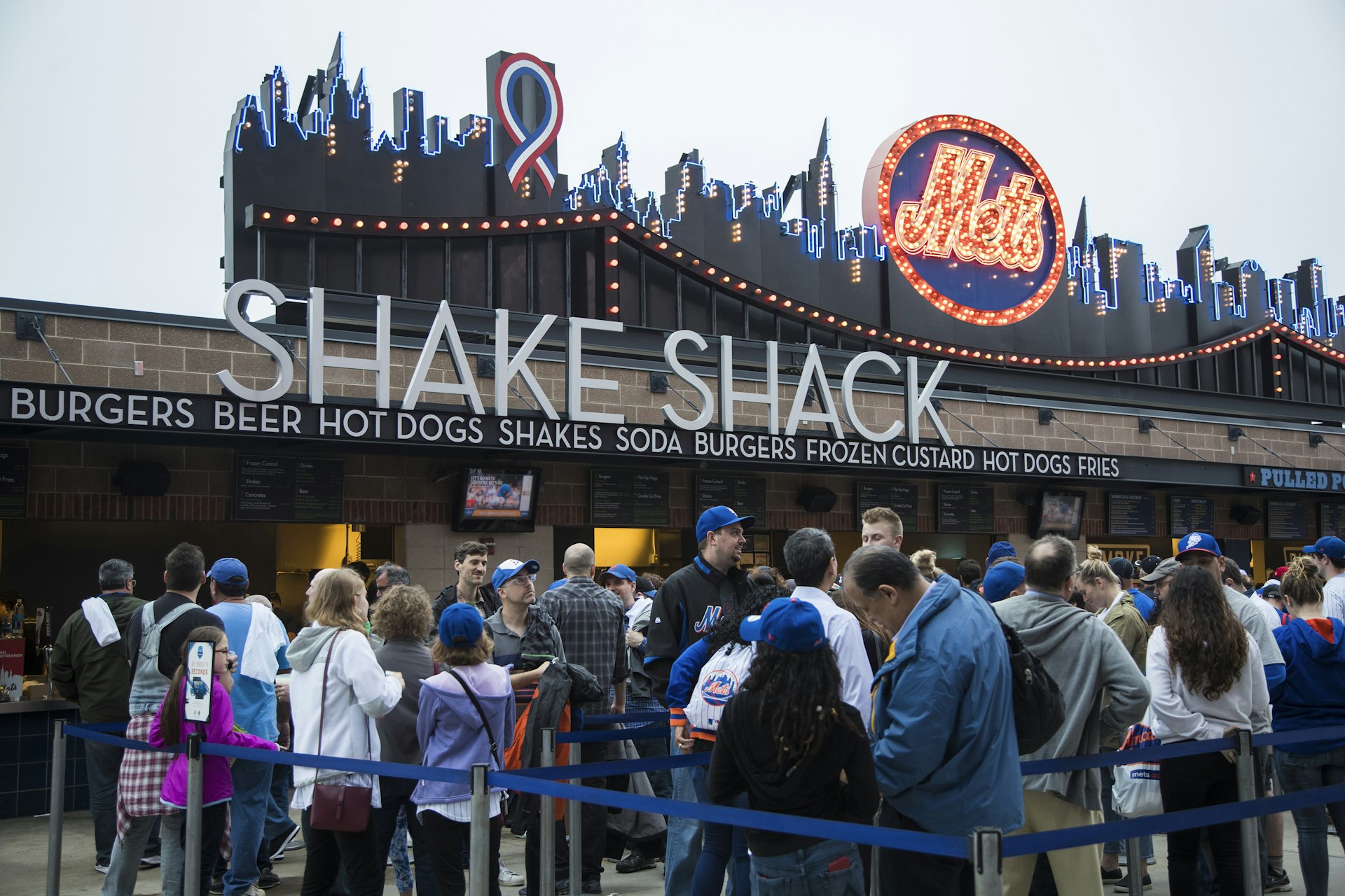 View of fans on line at Shake Shack food concession stand before New York Mets vs Washington Nationals game at Citi Field, Flushing, Queens, New York City, New York, USA