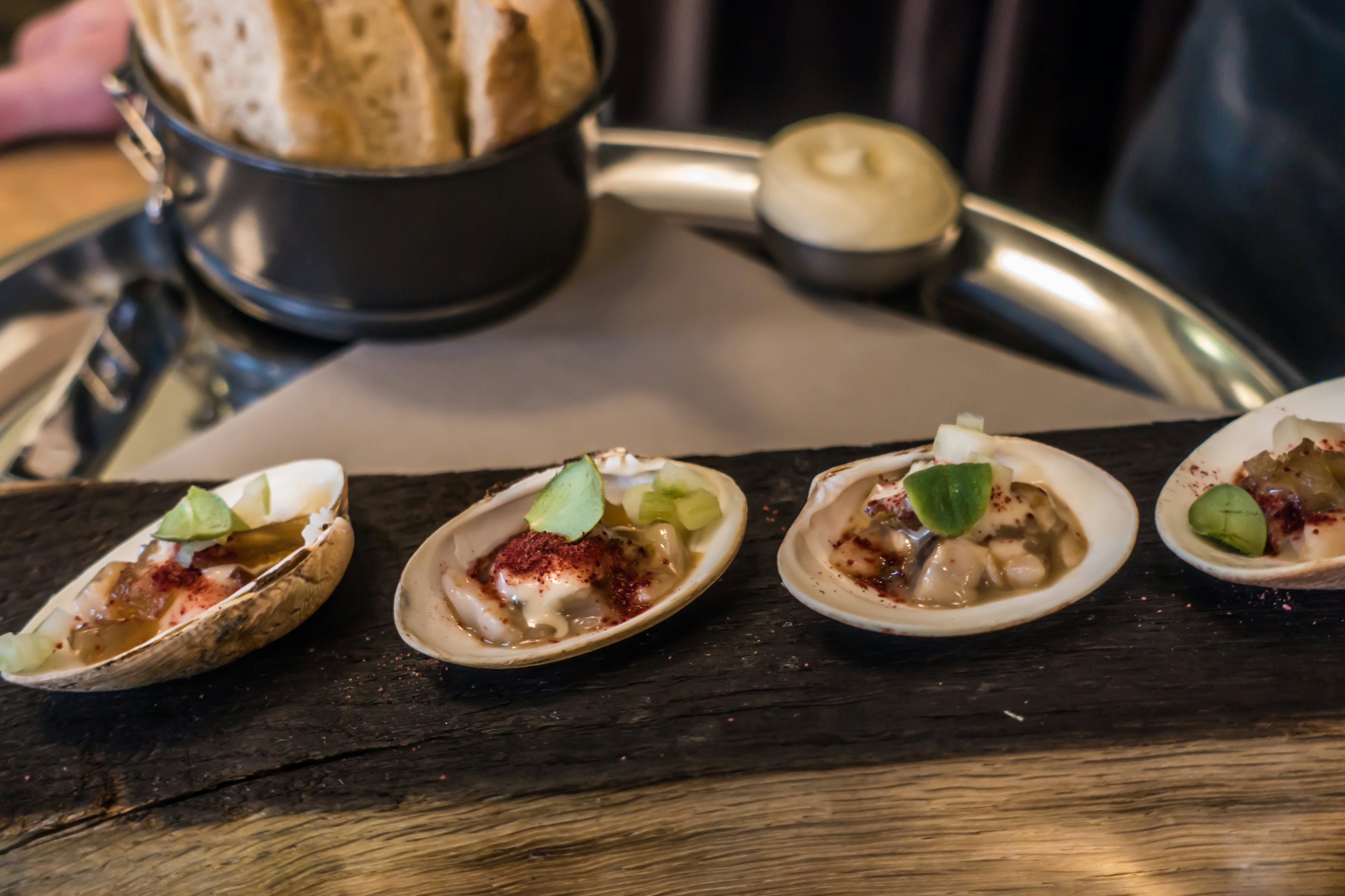 Amuse buche in shells at a restaurant in Bergen, Norway