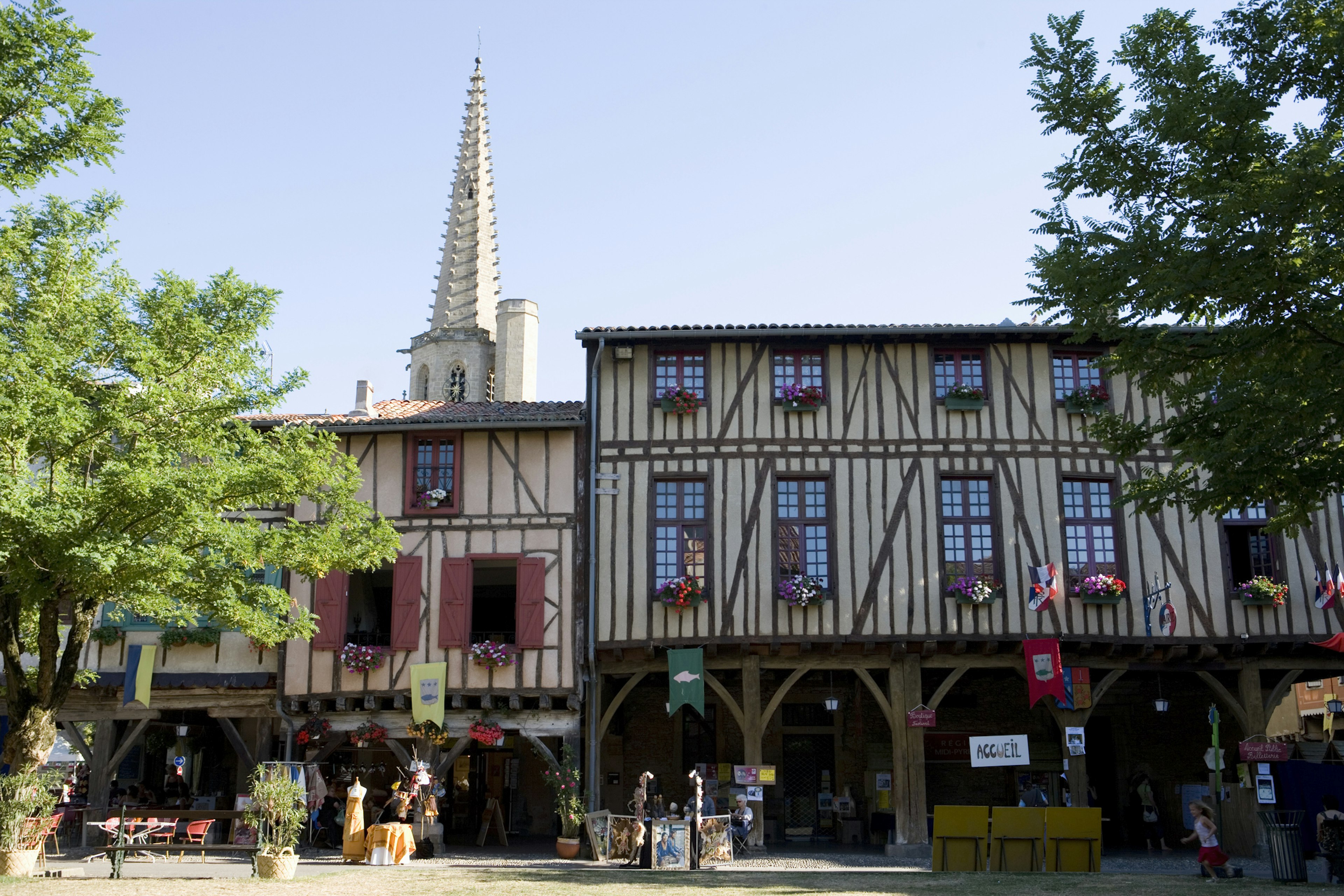 A row of colorful half-timbered houses in the Place de la Couverts in Mirepoix, France