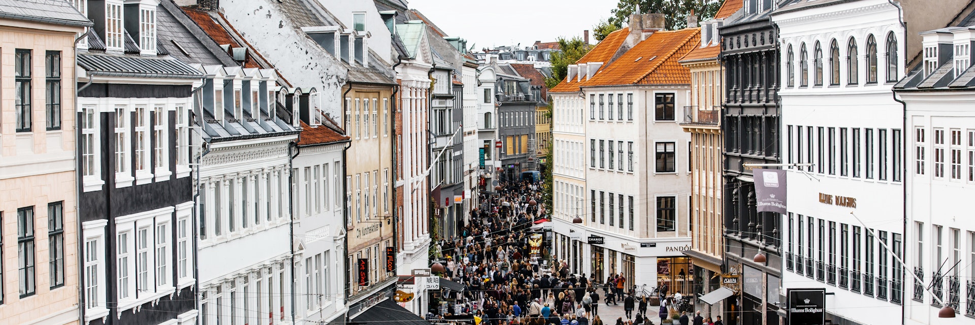 High-angle view of a busy shopping street in Copenhagen.
Rooftop, Photography, Denmark, Road, Population Explosion, Scandinavian Culture, Overcast, City, Window, Cafe, Tourist, Consumerism, Restaurant, Copenhagen, Facade, City Life, Danish Culture, Aerial View, Urban Skyline, Day, Diminishing Perspective, Amagertorv, Crowd, Retail, City Street, Capital Cities, Town Square, Sky, Street, Famous Place, International Landmark, Large Group Of People, Tourism, Retail Place, Shopping, Travel, Cityscape, Architecture, Old, Oresund Region, Building Exterior, People, Color Image, Sidewalk Cafe, Outdoors, High Angle View, Travel Destinations, Horizontal, Pedestrian Zone