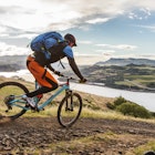 Mountain biker riding on a trail along the Columbia River in Hood River, Oregon.

