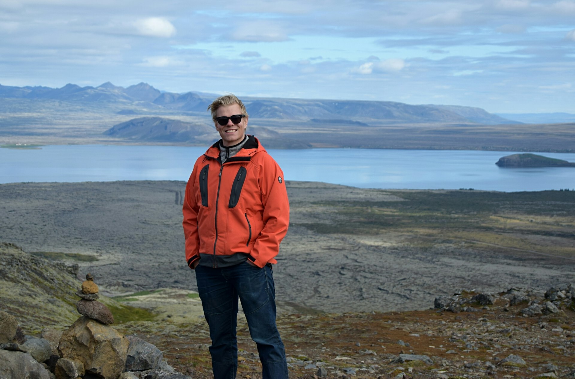 Local expert Gunnar Þór Pálsson smiles for the camera with the Icelandic landscape behind him