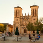 A couple having an evening drink in front of San Fernando Cathedral, San Antonio, Texas USA