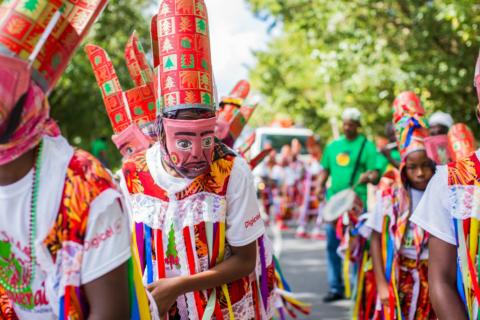 A group of people wear colorful African-inspired costumes during Montserrat's St Patrick's celebrations