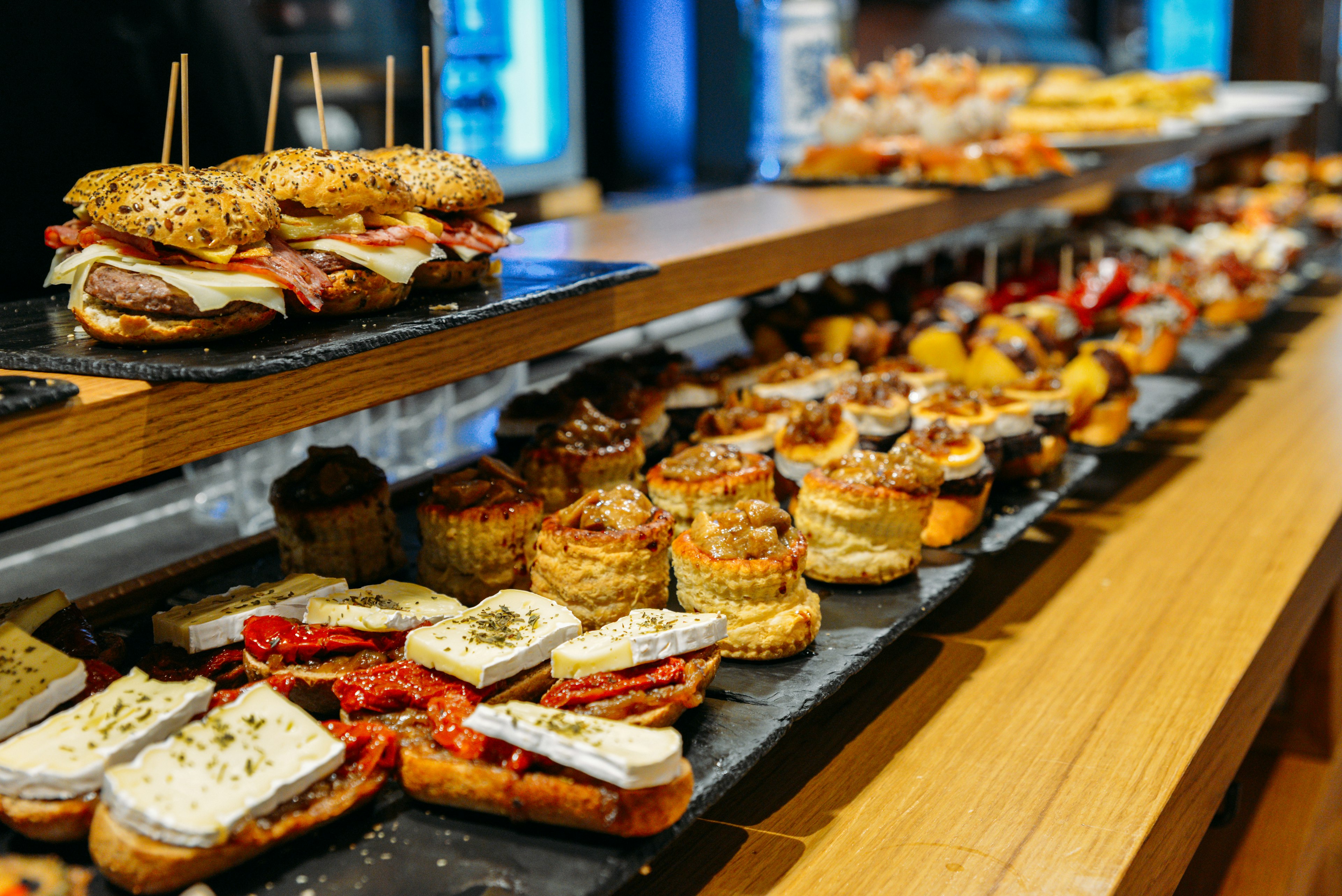 Spanish tapas (pintxos) of the Basque country served on a bar counter at a restaurant in San Sebastian.