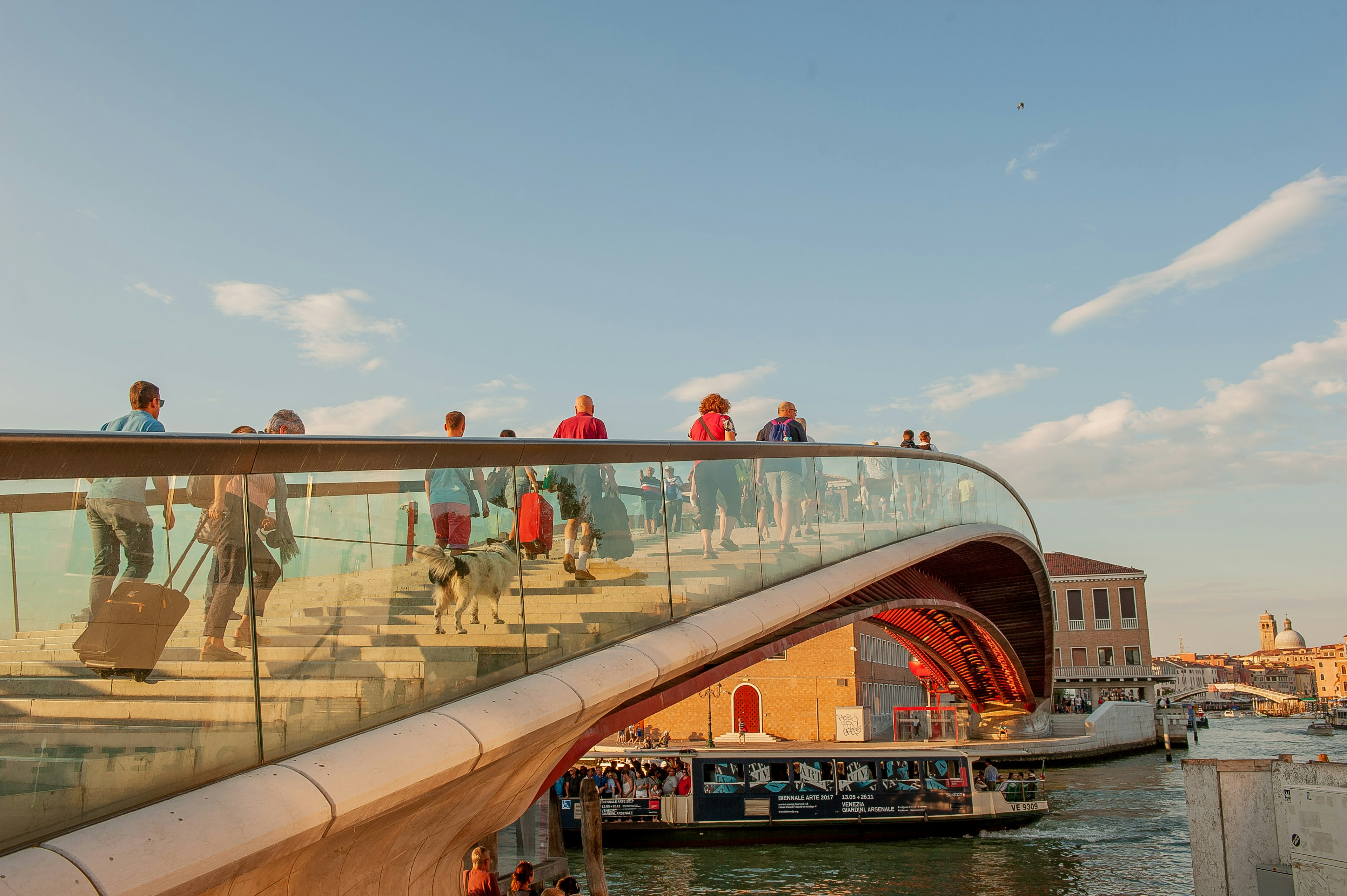 Pedestrians cross Calatrava Bridge, which connects Venice Station to a parking lot.