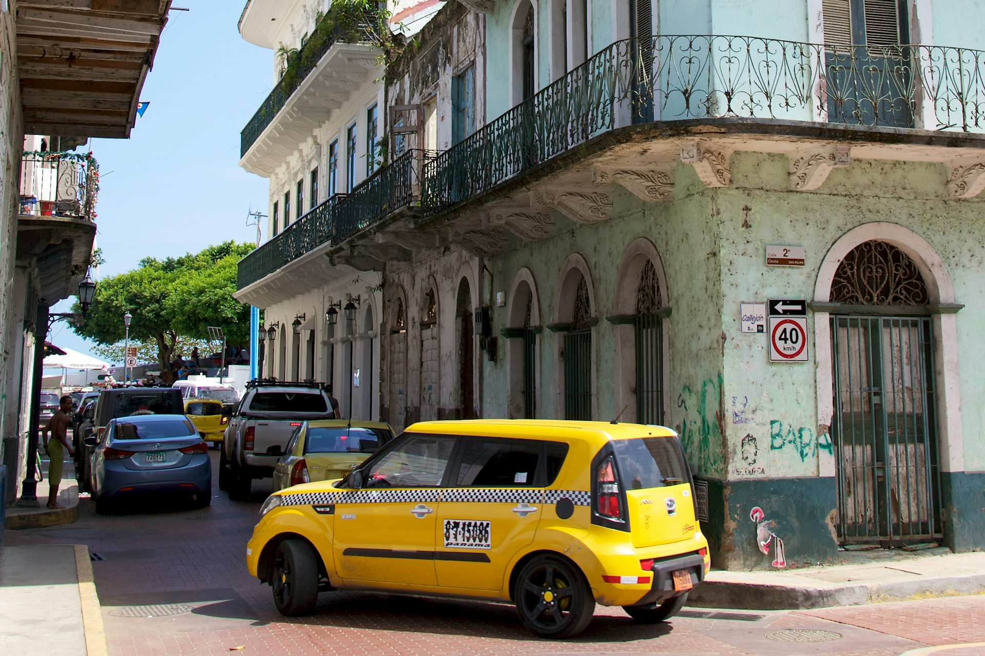 A taxi turning down a narrow street in Casco Viejo, the historic district of Panama City Panama