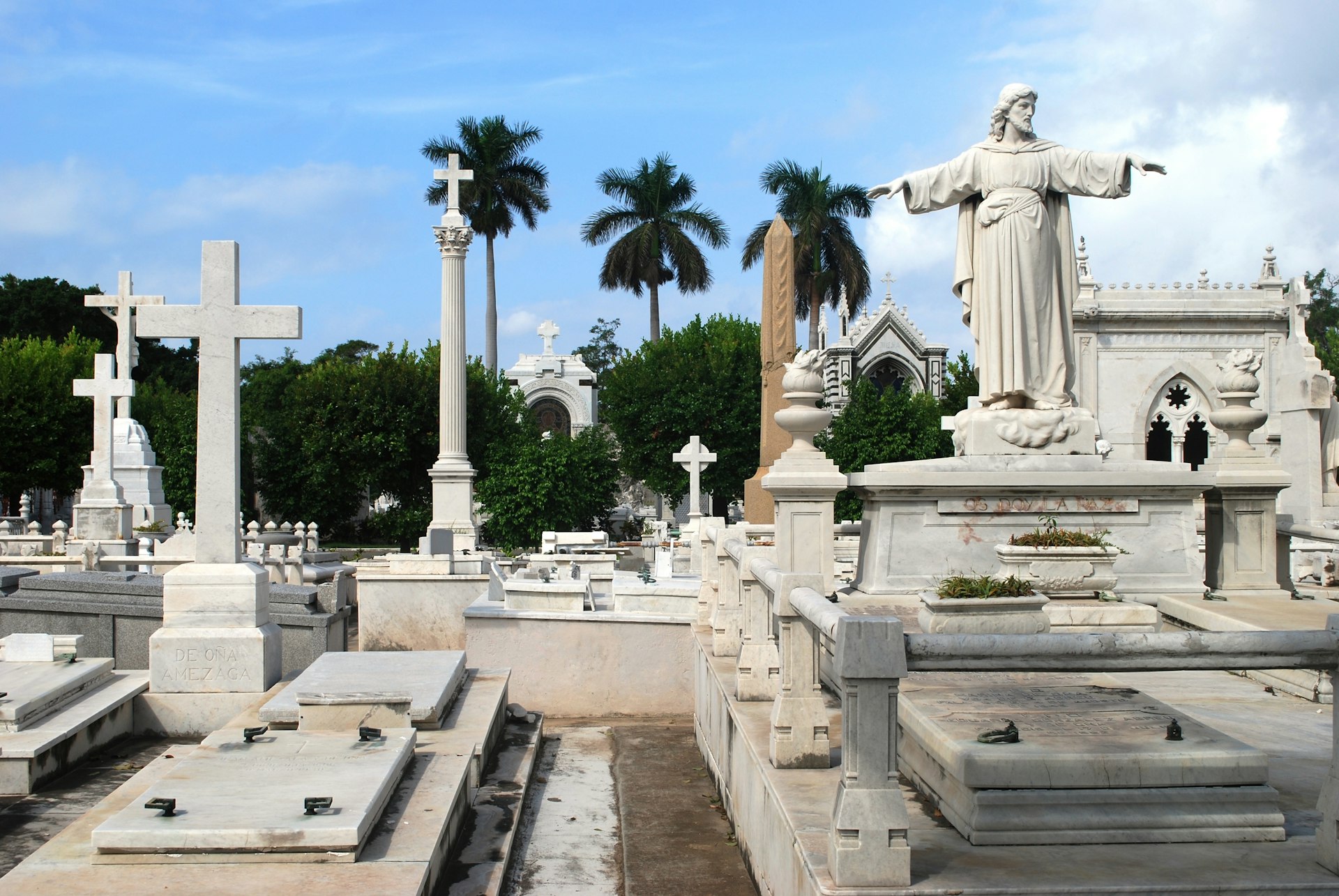 White statues and mausoleum light up in the sunshine inside Havana's Necrópolis Cristóbal Colón cemetery 