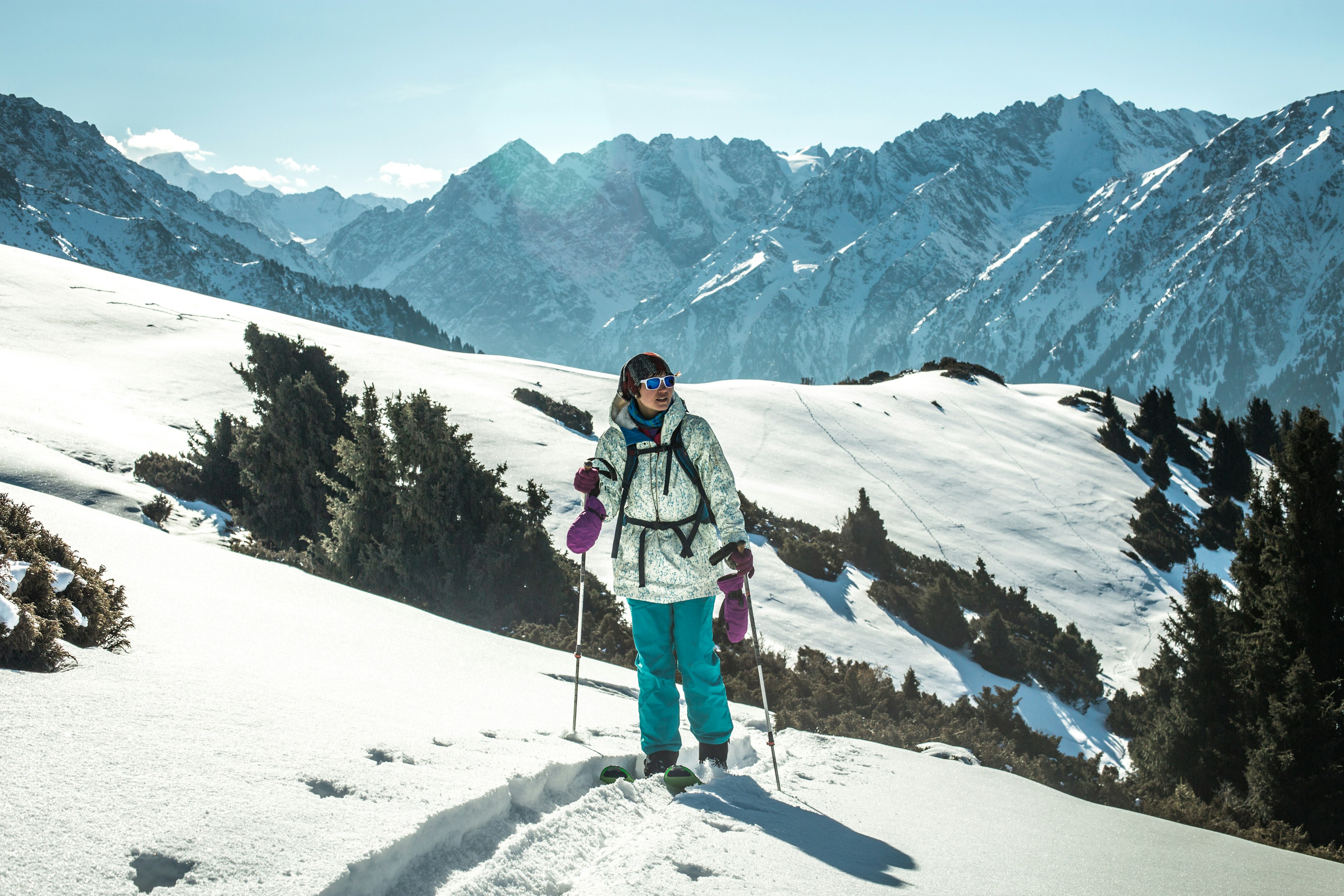 A cross-country skier on a snow-filled mountain