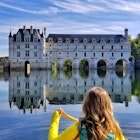 A woman canoeing toward Chateau de Chenonceau in Loire Valley, France; Shutterstock ID 1042880332; your: Claire Naylor; gl: 65050; netsuite: Online editorial; full: Loire Valley things to do
1042880332