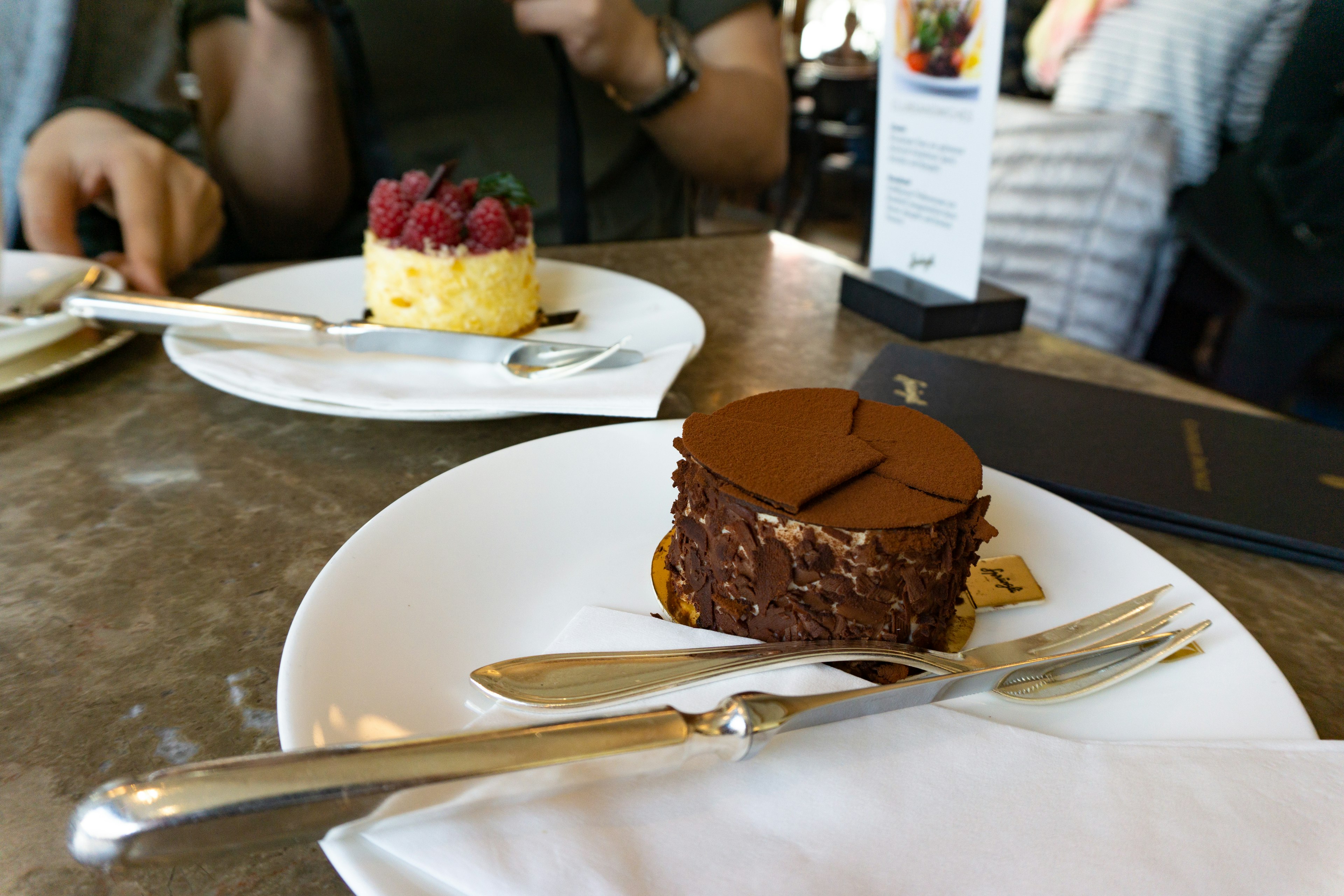 Cream-soufflée-pâtisserie and raspberry cream pâtisserie served in Spruengli dessert cafe in Zurich.