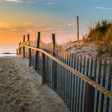 Sunrise glows at the Atlantic seashore at Marine St. in Beach Haven, New Jersey.