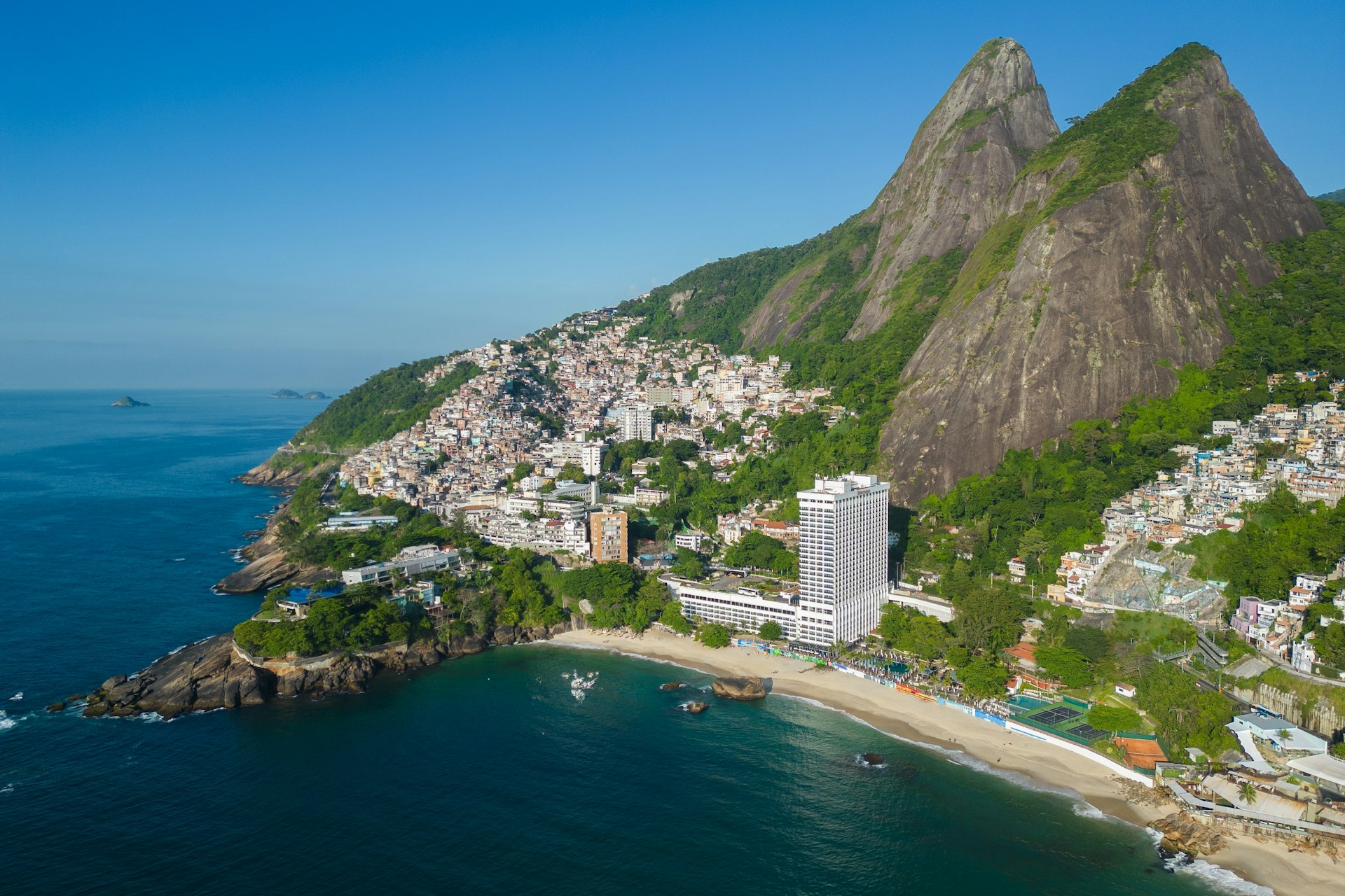 Aerial view of Two Brothers mountain with Vidigal on its side and the beach below