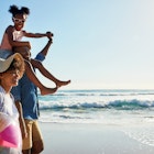 Walking, beach and profile of relax black family travel, happy and enjoy outdoor quality time together. Ocean sea water, blue sky mockup or freedom for bonding people on Jamaica holiday in summer; Shutterstock ID 2251915893; your: Claire Naylor; gl: 65050; netsuite: Online ed; full: Jamaica with kids
2251915893
