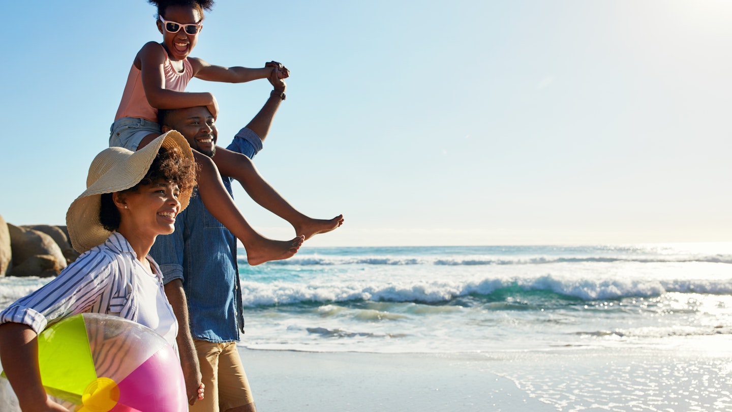 Walking, beach and profile of relax black family travel, happy and enjoy outdoor quality time together. Ocean sea water, blue sky mockup or freedom for bonding people on Jamaica holiday in summer; Shutterstock ID 2251915893; your: Claire Naylor; gl: 65050; netsuite: Online ed; full: Jamaica with kids
2251915893