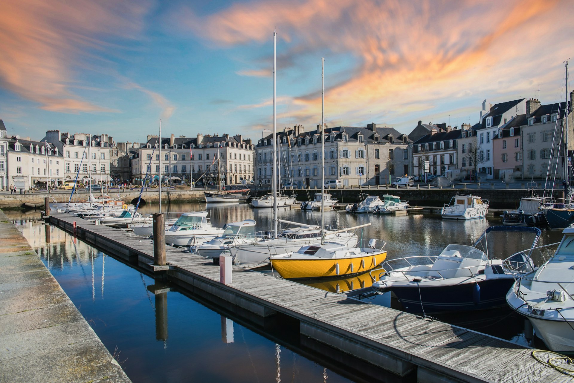 Vannes, medieval city in Brittany, with boats in the harbor and typical houses in the background, France 