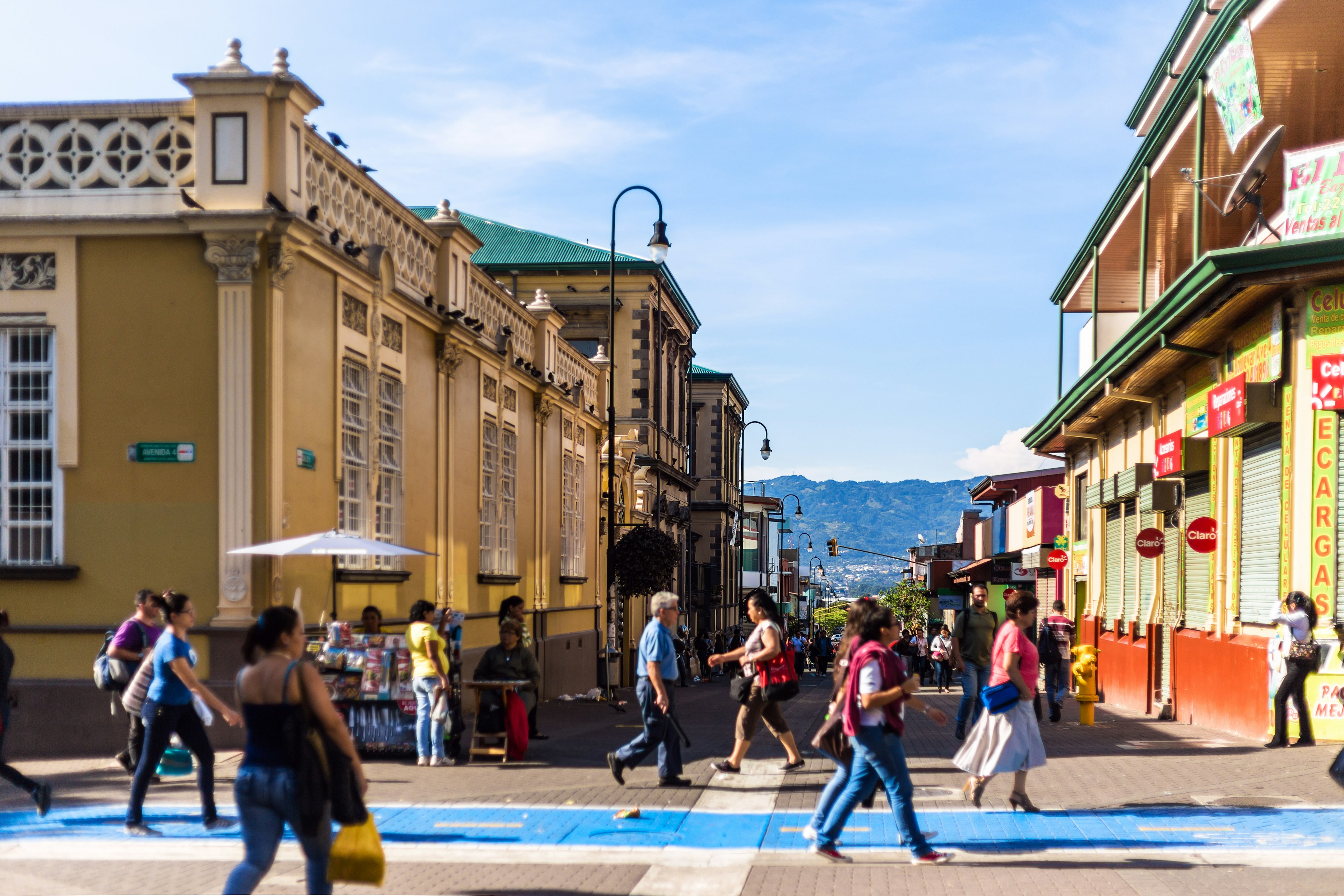 Pedestrians walk along the downtown historical area of San José, Costa Rica, in the middle of the day