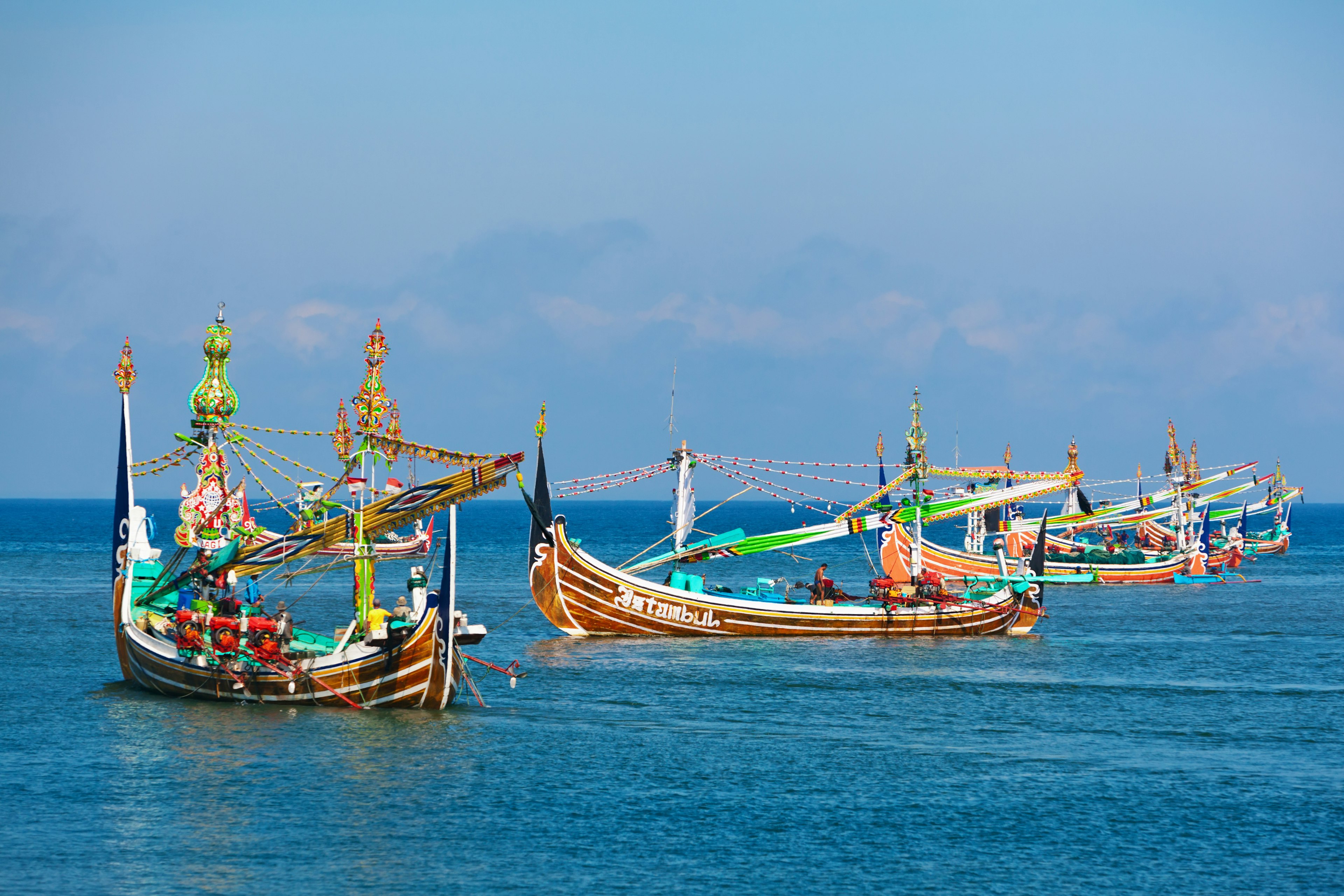 Traditional selerek fishing boats bob off the coast of Jembrana on Bali. Denis Moskvinov/Shutterstock