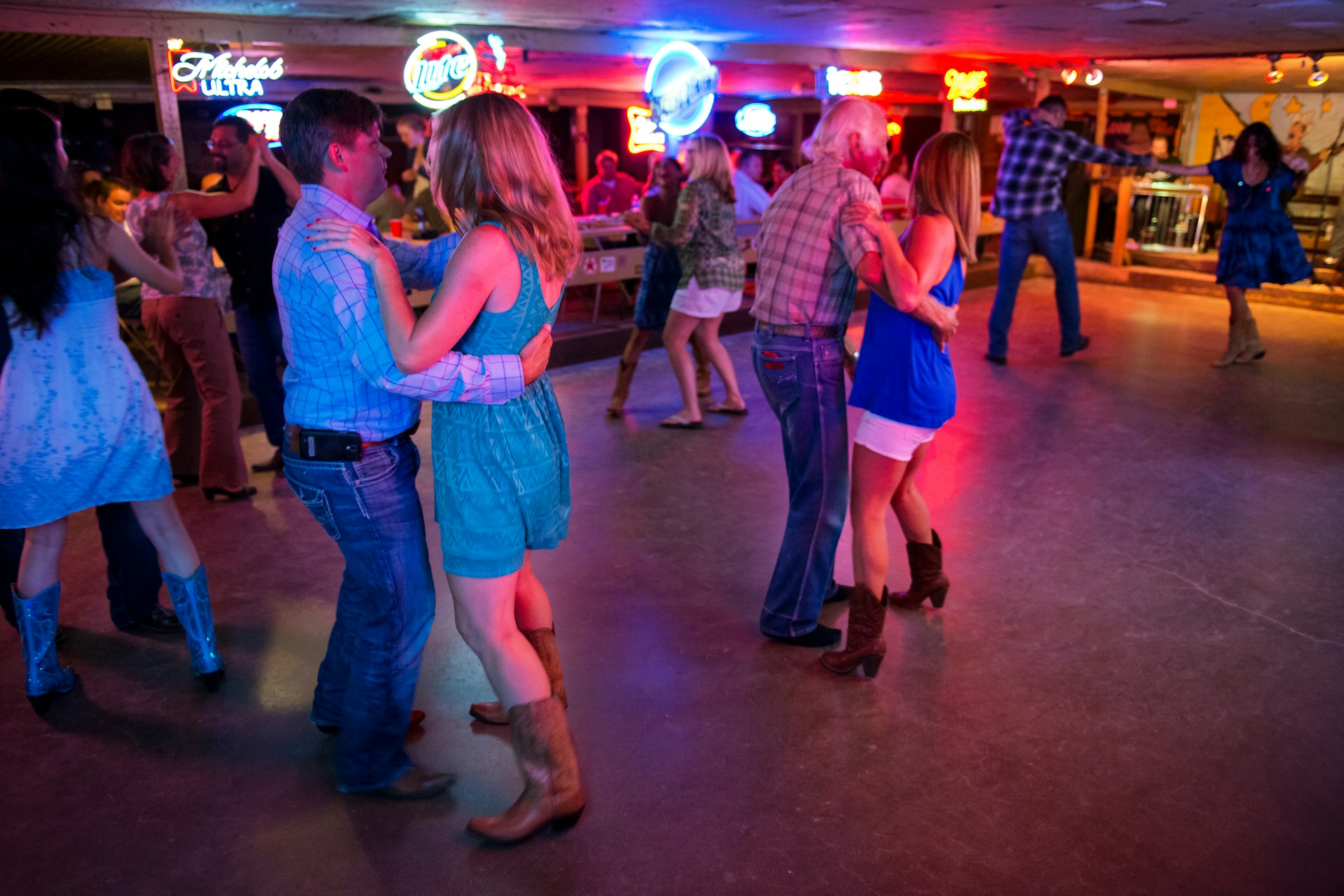People dancing to country music in the Broken Spoke dance hall in Austin, Texas, USA