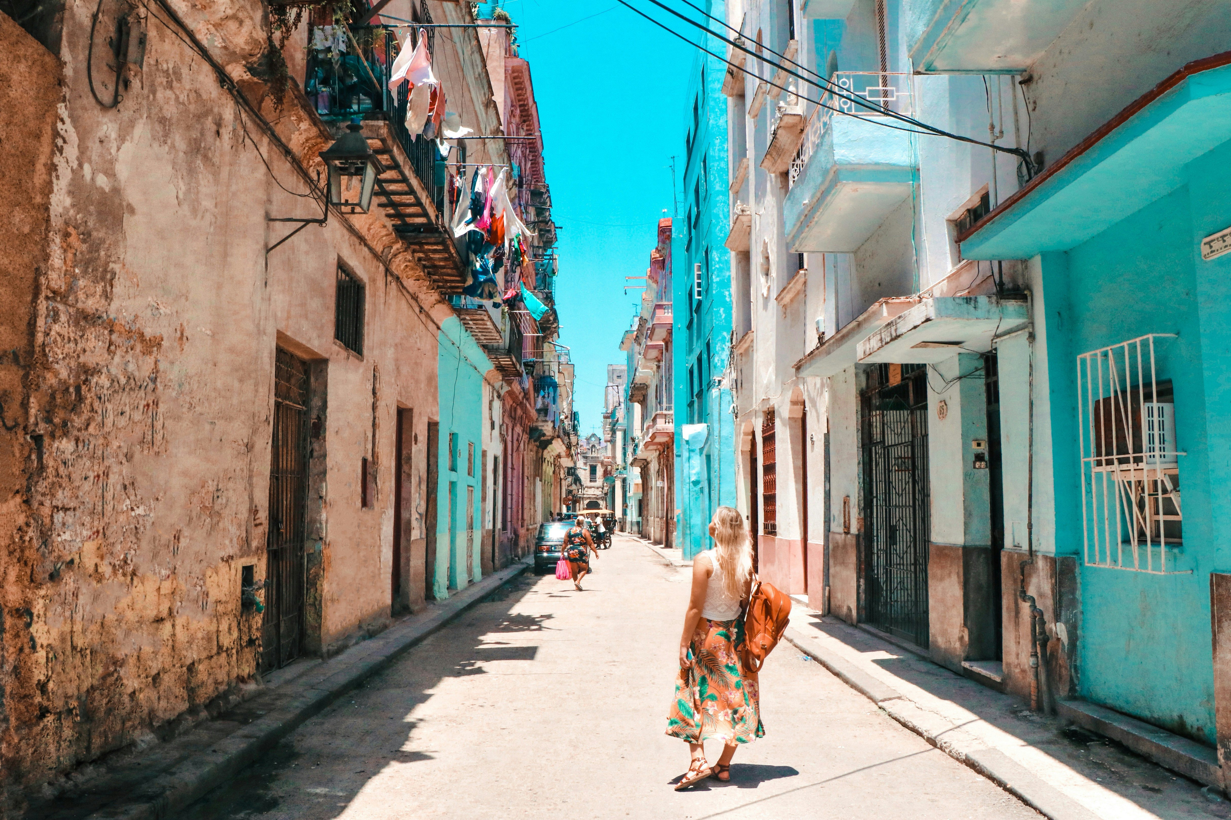 Tourist woman walking on a street in Old Havana, Cuba, on a sunny day