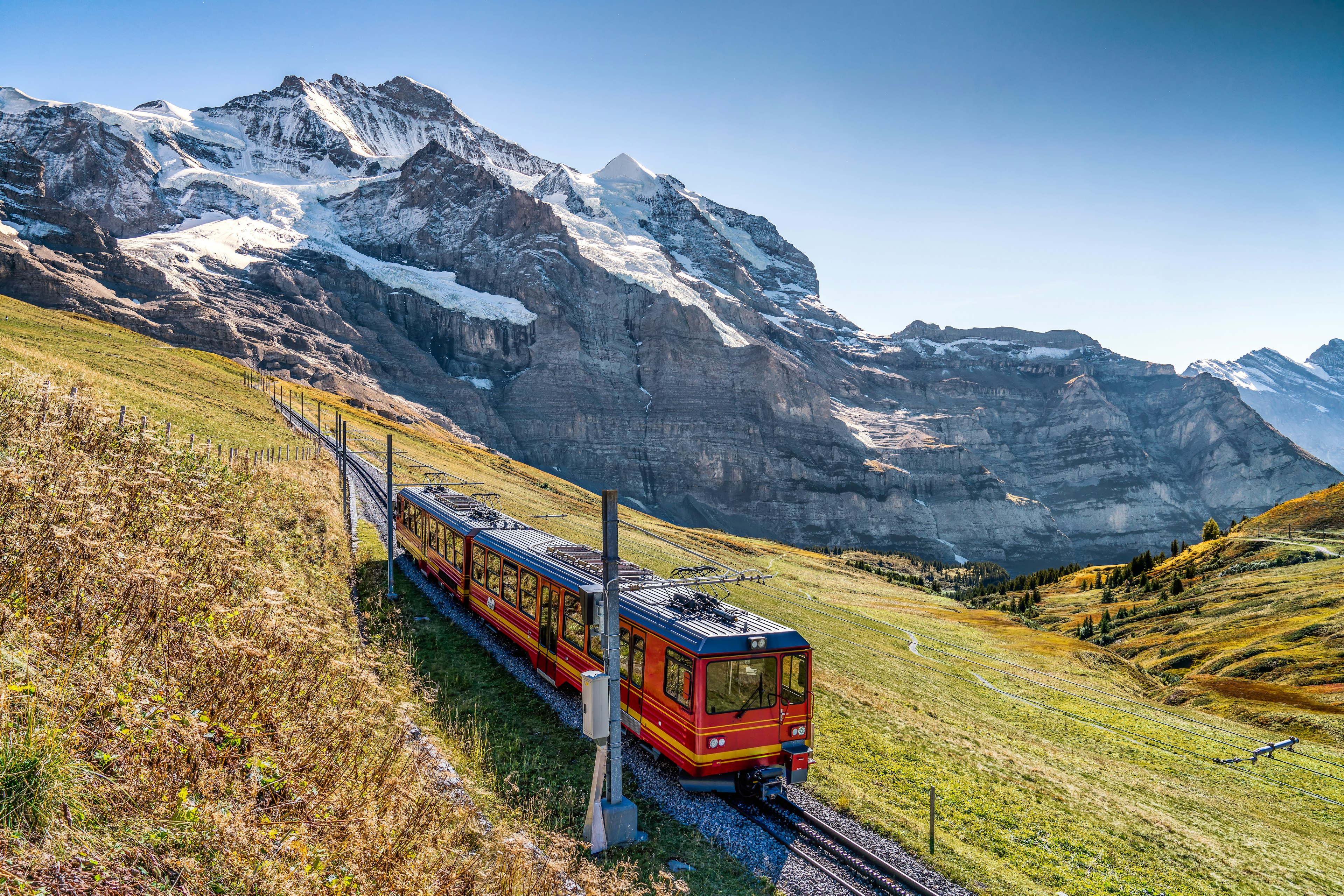 The red train running on the Jungfrau Railway in Switzerland.