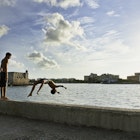 1131213193
10-11 years, 8-9 years, backflipping, beach, beauty in nature, building exterior, carefree, childhood, city, city life, coastline, copy space, cuba, enjoyment, freedom, friendship, full length, fun, getting away from it all, happiness, havana, innocence, lifestyles, looking down, male friendship, nature, only boys, outdoors, playing, sea, sharing, showing off, side view, standing, summer, sunlight, swimming trunks, swimwear, tourism, travel, travel destinations, two people, upside down, water, clothing, wide angle, boy, cloud, diving, escape, fooling around, male, mid air, view