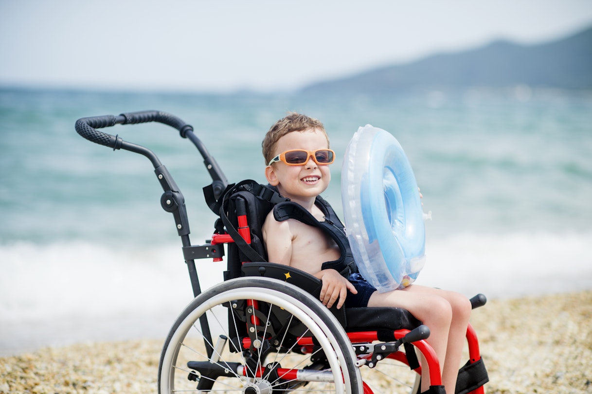 Cute boy in wheelchair going to swim
1164411231