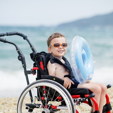 Cute boy in wheelchair going to swim
1164411231