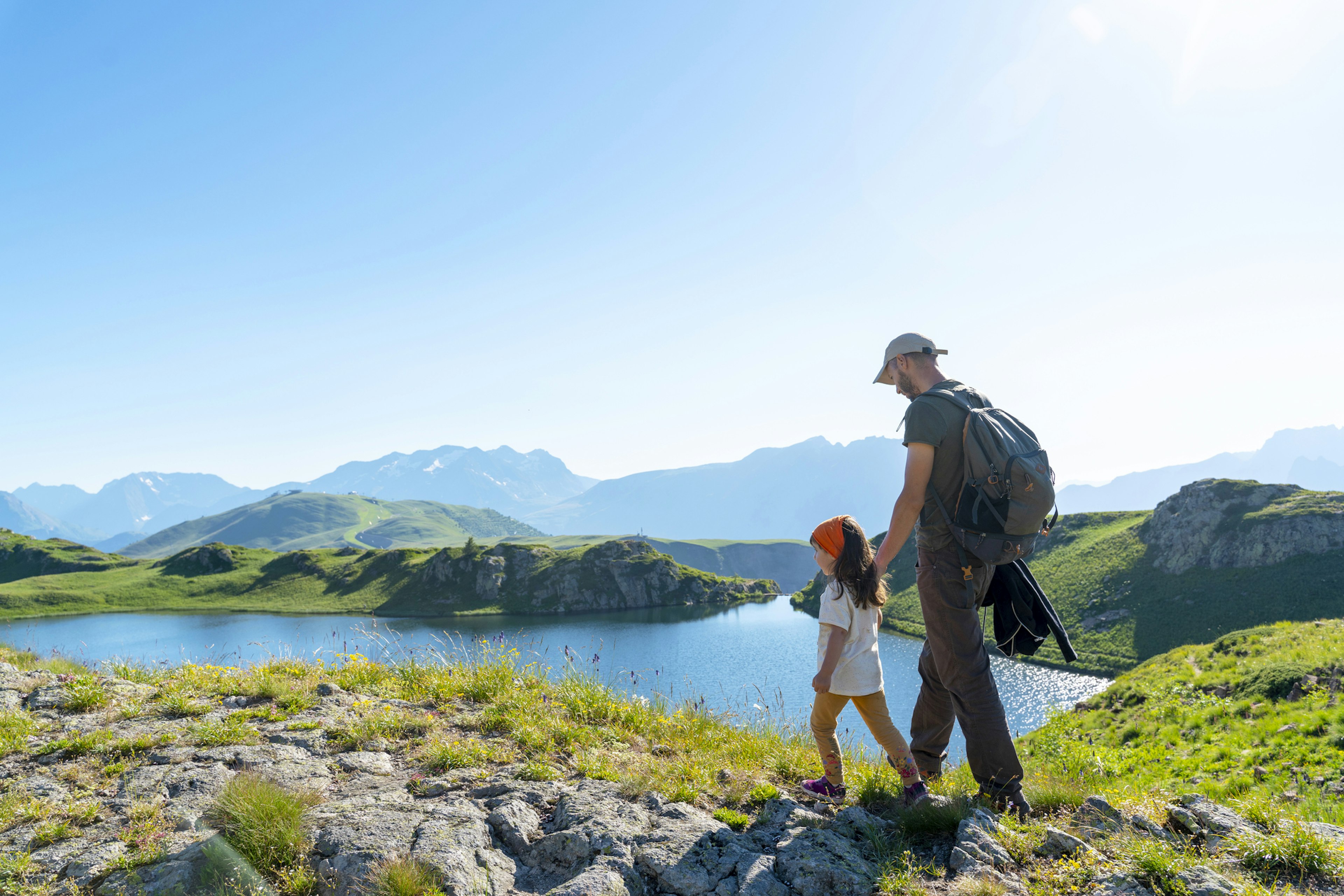 Father and daughter walking through the French countryside on a sunny day