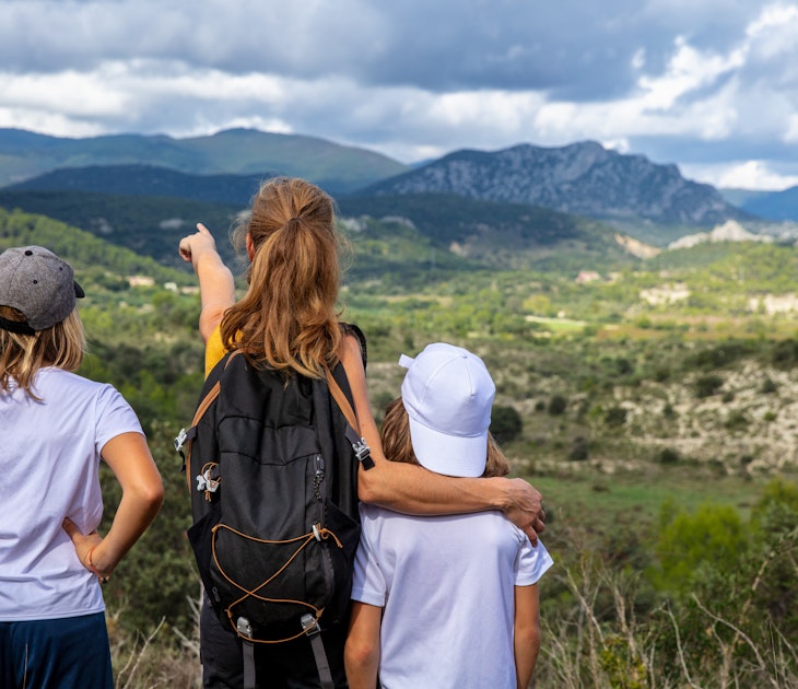 Family looking at Cevennes mountain background in France
1433750405
activity
A woman and two kids looking over Cévennes National Park from a hilltop