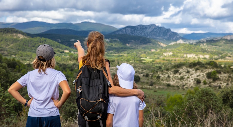 Family looking at Cevennes mountain background in France
1433750405
activity
A woman and two kids looking over Cévennes National Park from a hilltop
