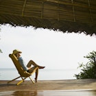 Bocas del Toro Island, Caribbean coast, Panama
200254863-001
vacation, leisure, relaxed
A woman relaxing on the deck of a seaside bungalow in Bocas del Toro Island, Panama