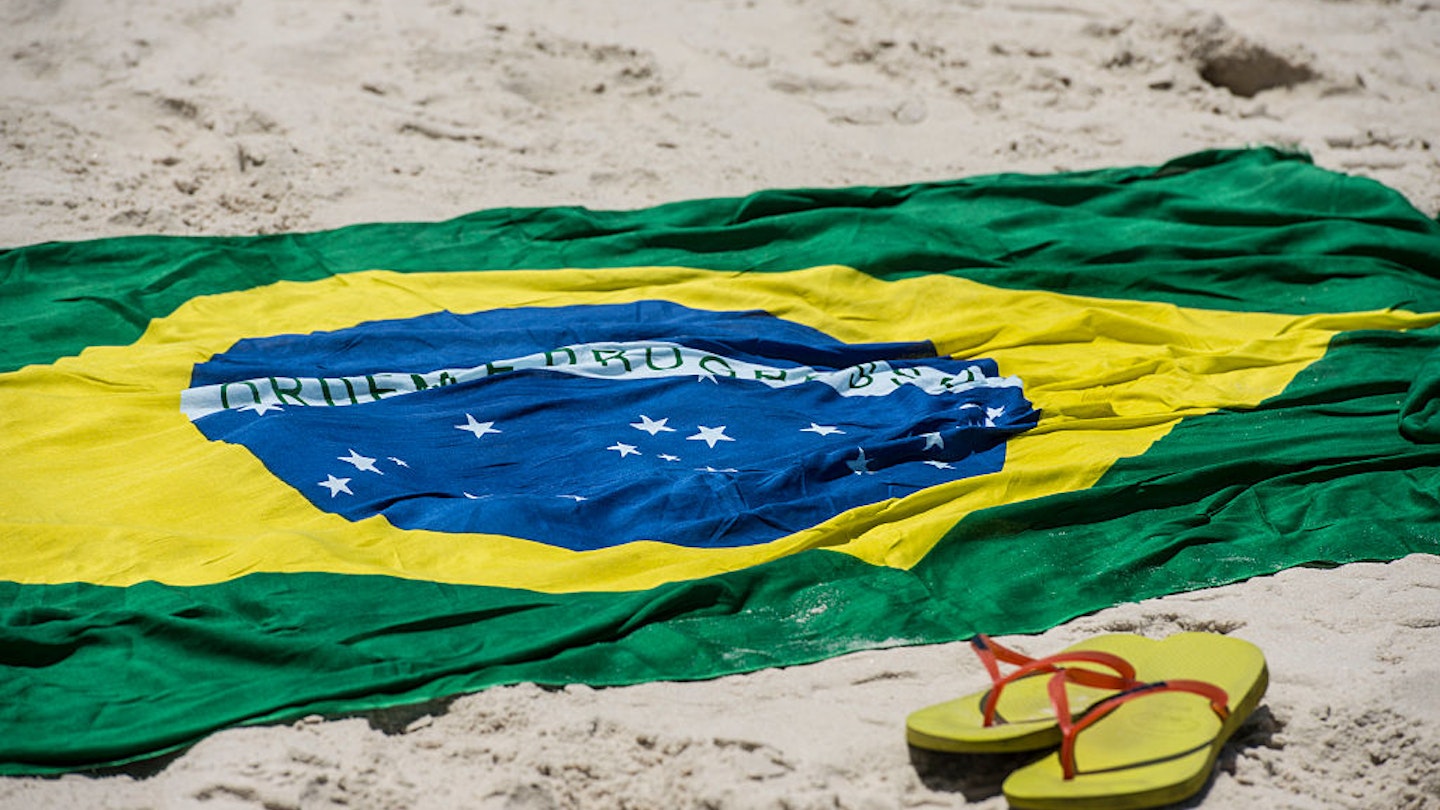 brazilian flag and havaianas at Copacabana's beach , Rio de Janeiro, Brazil on Tuesday February 18th, 2014 (Photo by Paulo Fridman/Corbis via Getty Images)
542647306
sand:CB2, flag:CB2, beach:CB2, Copacabana:CB2, sun:CB2, rj:CB2, sun.:CB2