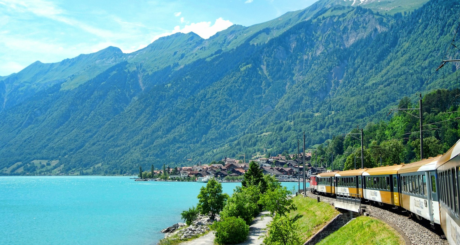 Wonderful view of houses and mountains at Lake Brienz, east of Interlaken from a window of Golden Pass Express train, destined for Lucerne, Switzerland
