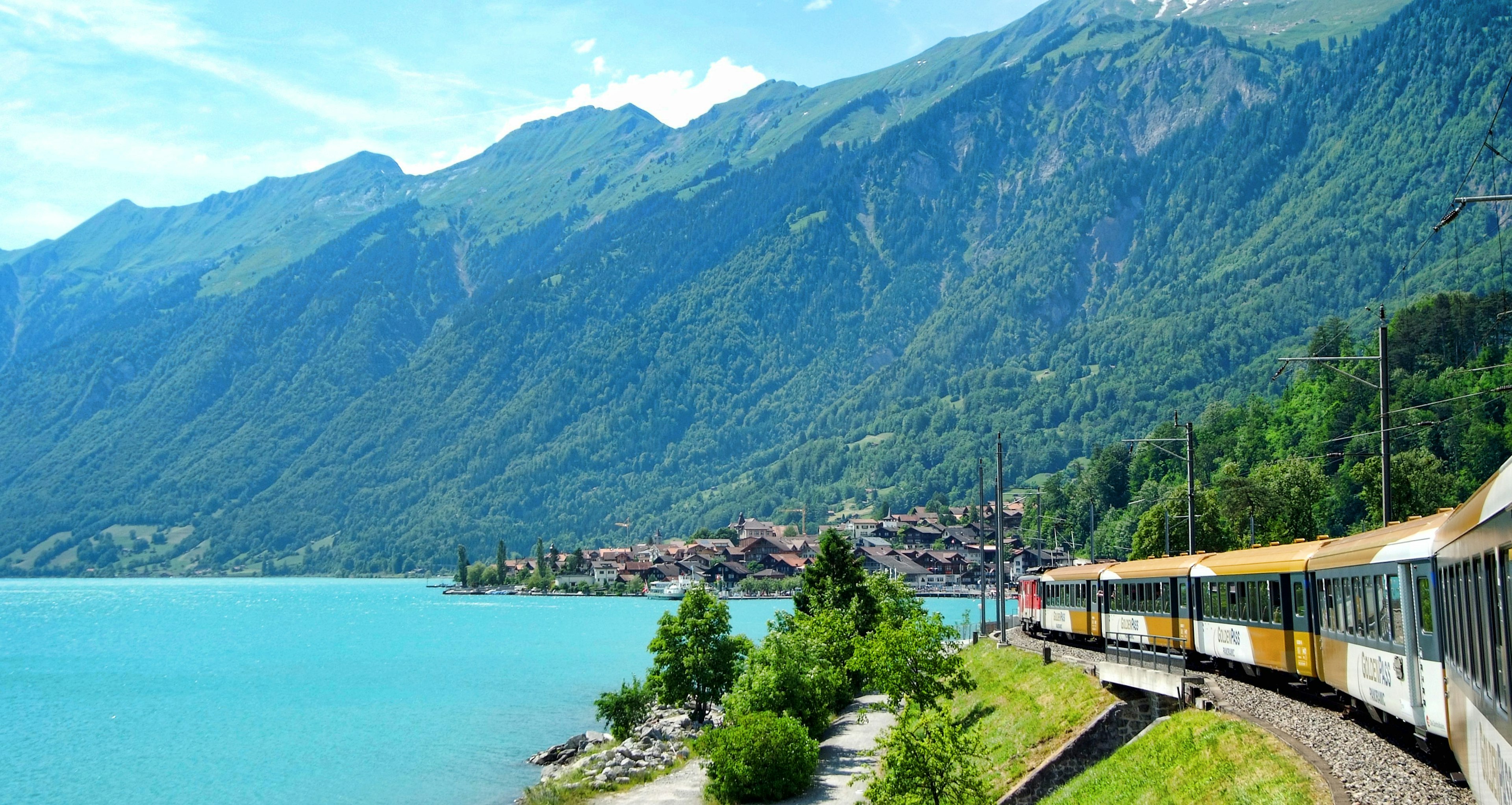 Wonderful view of houses and mountains at Lake Brienz, east of Interlaken from a window of Golden Pass Express train, destined for Lucerne, Switzerland