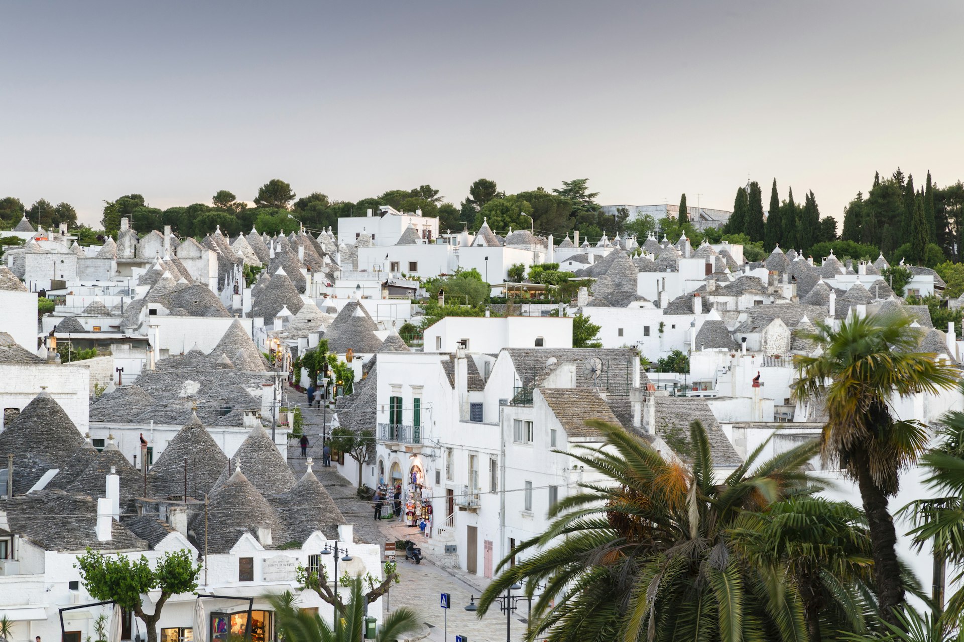 View of Alberobello's Rione Monti district and its trulli – traditional white round houses – at dusk