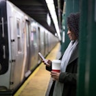 Young woman waiting for the subway train in New York, USA.
903465526