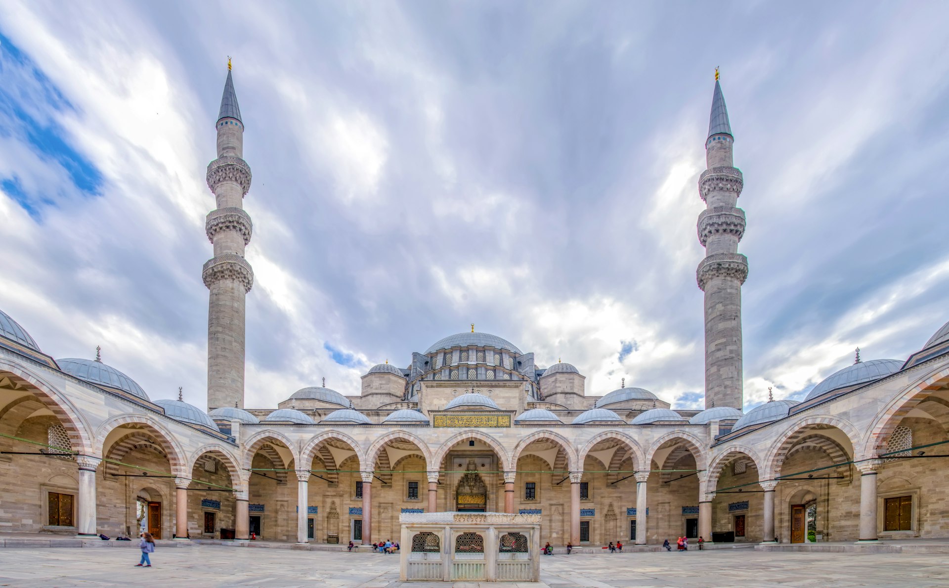 A wide view of people walking past the Suleymaniye Mosque on the Third Hill of Istanbul