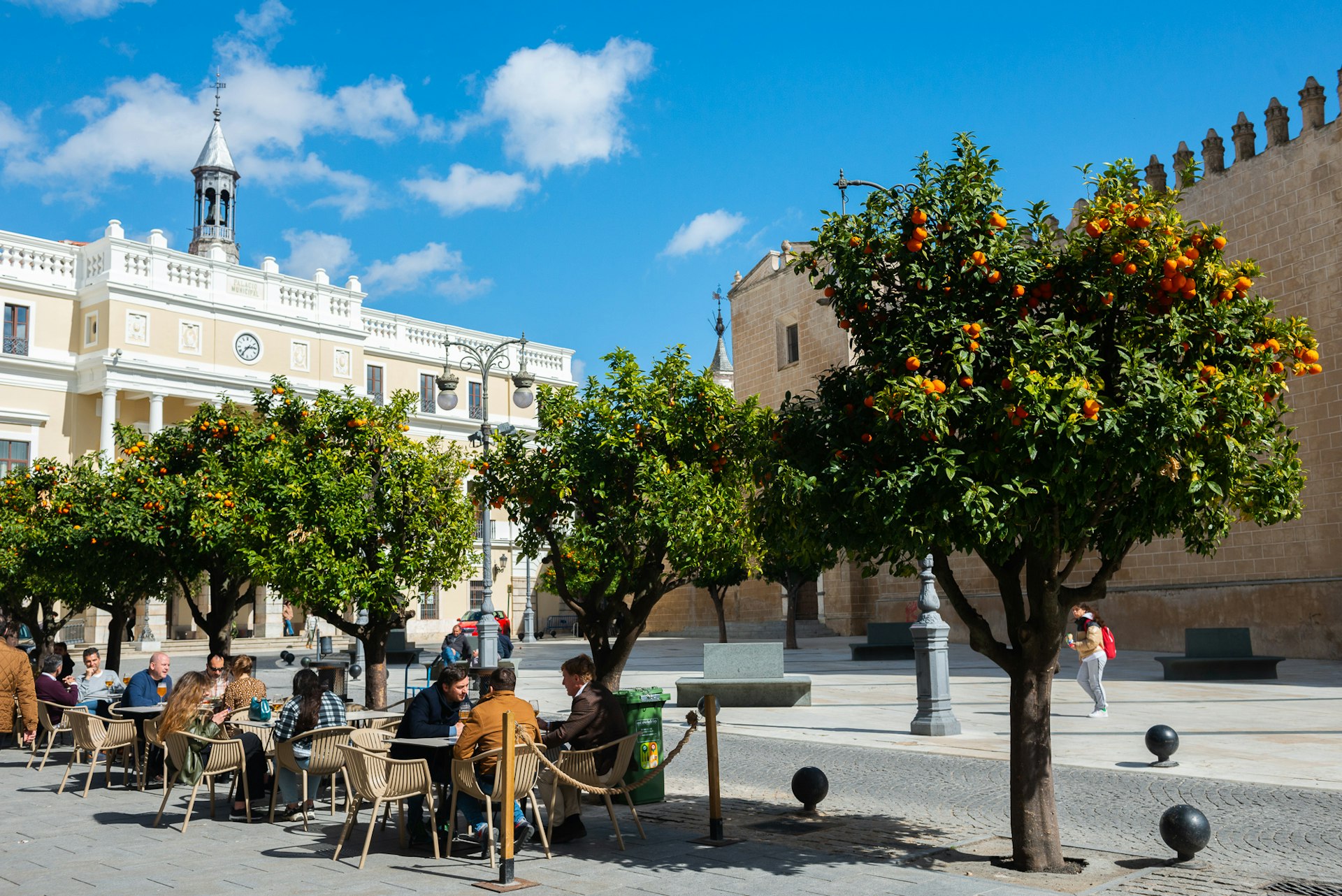 People dining outdoors at Plaza de España, Badajoz, Spain