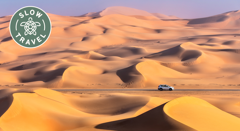 Driving through Rub al Khali Desert, also known as the Empty Quarter, in UAE.