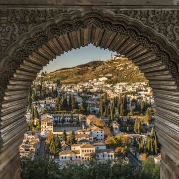 View of the Albayzin district of Granada, Spain, from a window in the Alhambra palace near sunset.
341928434
albaicin, albayzin, alhambra, ancient, andalusia, arabesque, arabic, archeology, architecture, art, artistic, artwork, castle, city, fortress, granada, lush, medieval, moor, moorish, mountain, muslim, ornate, palace, porthole, religion, sacred, spain, spanish, stone, view, wall, wealthy, window