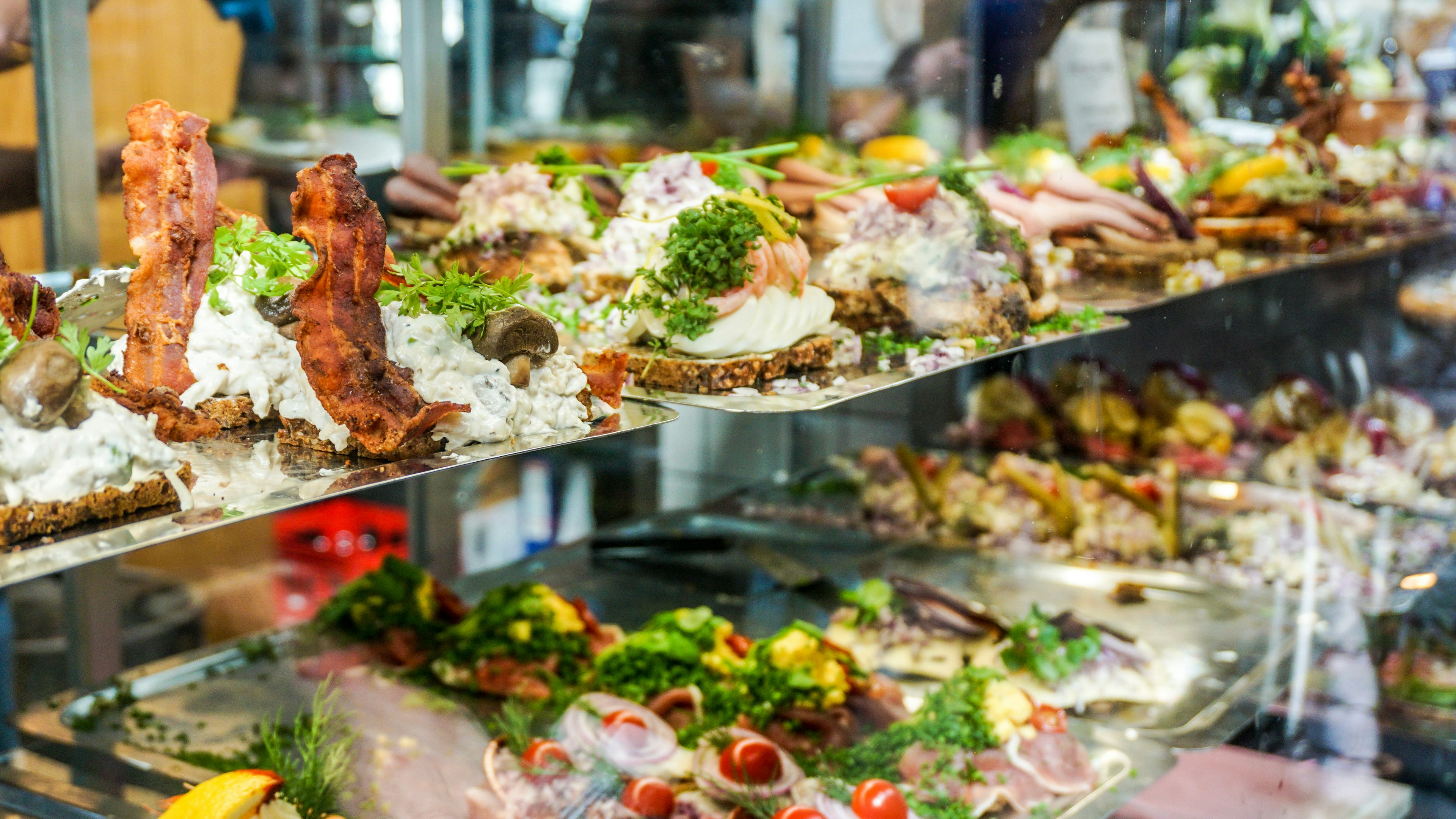 Smørrebrød, Danish open sandwiches, on display at a Copenhagen market.